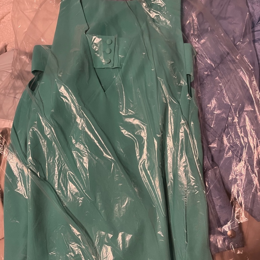 BRAND NEW teal summer dress. Button design on back. Sleeveless and so flowy.